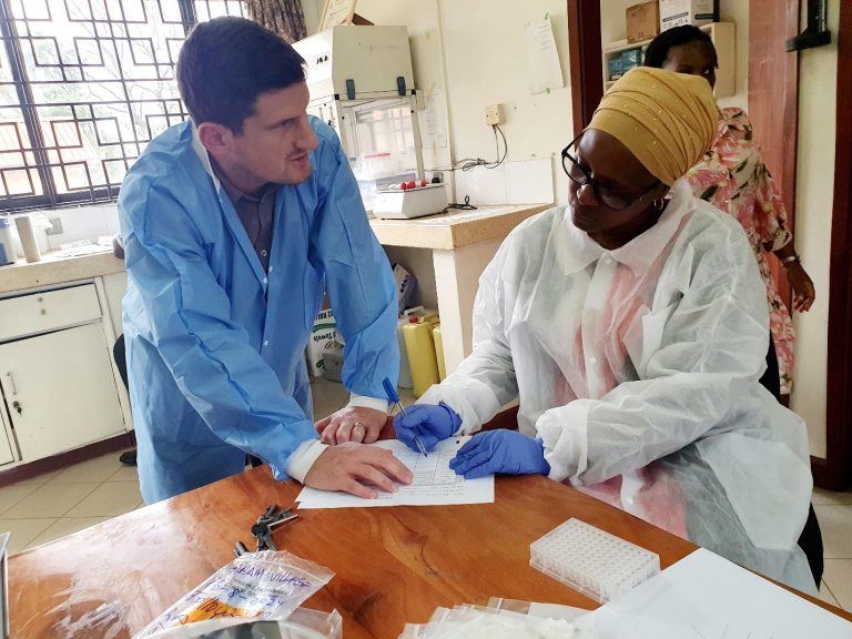 US CDC Microbiologist Mr. Scott Elder in a discussion with Uganda NTD Laboratory Technician Ms Christine Nahabwe