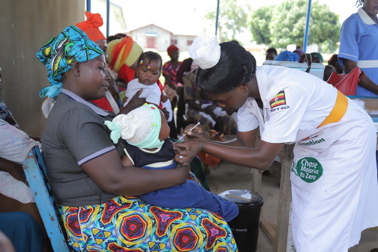 A health care worker administering malaria vaccine to children identified through defaulter tracking