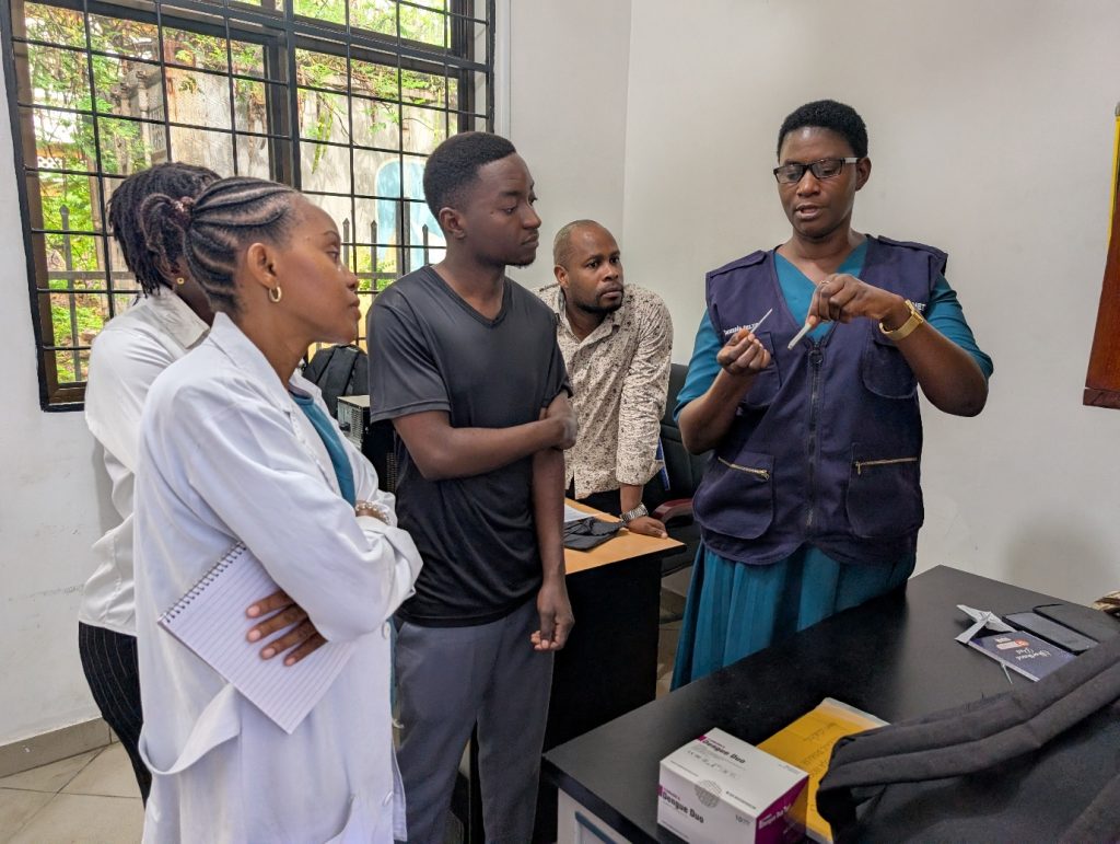 TFELTP Cohort 18 residents orienting laboratory staff of Mnazi Mmoja Hospital on the use of dengue rapid test kits, Dar es Salaam